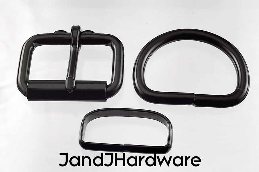 An image of a set of bkack hardware consisting of 2 each in black of a heel bar buckle, D ring and deluxe belt keeper.
